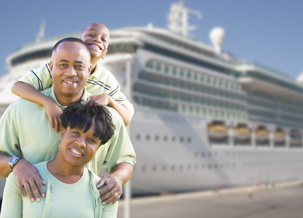 Happy African American Family in Front of Cruise Ship.