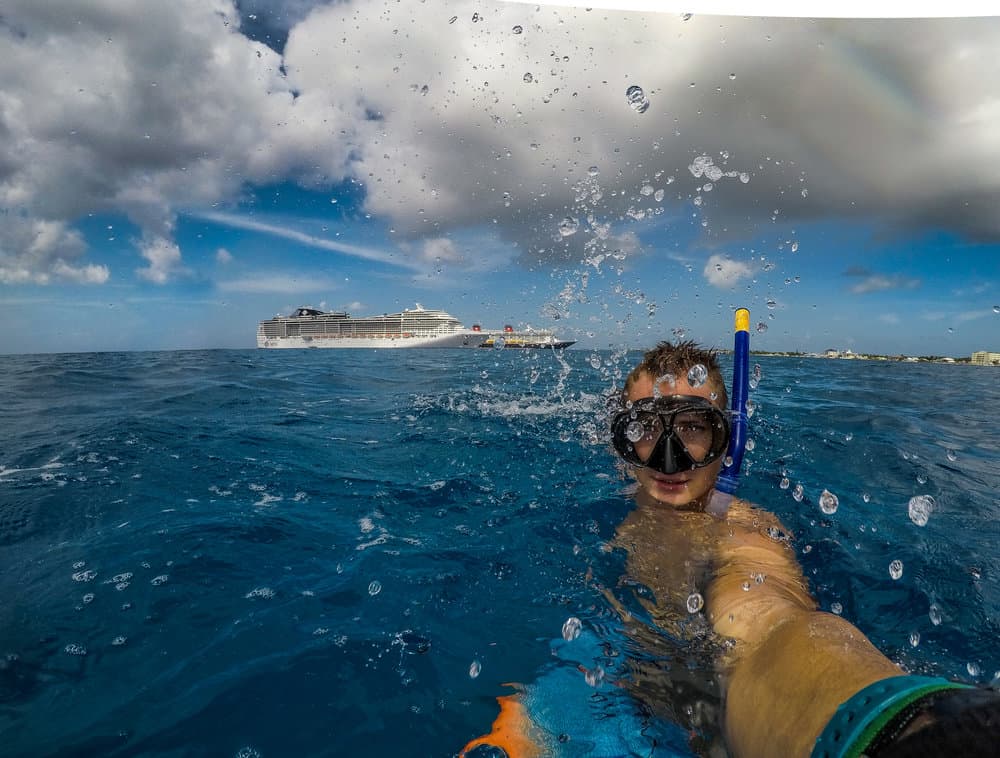 snorkeling near two cruise ships in the crystal blue Caribbean Sea 