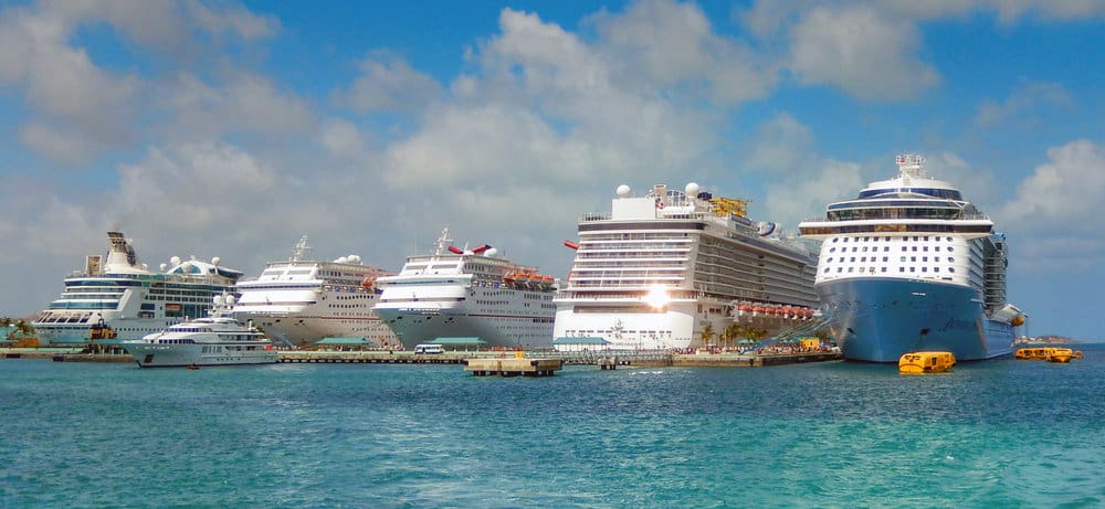 a row of cruise ships docked in the ocean