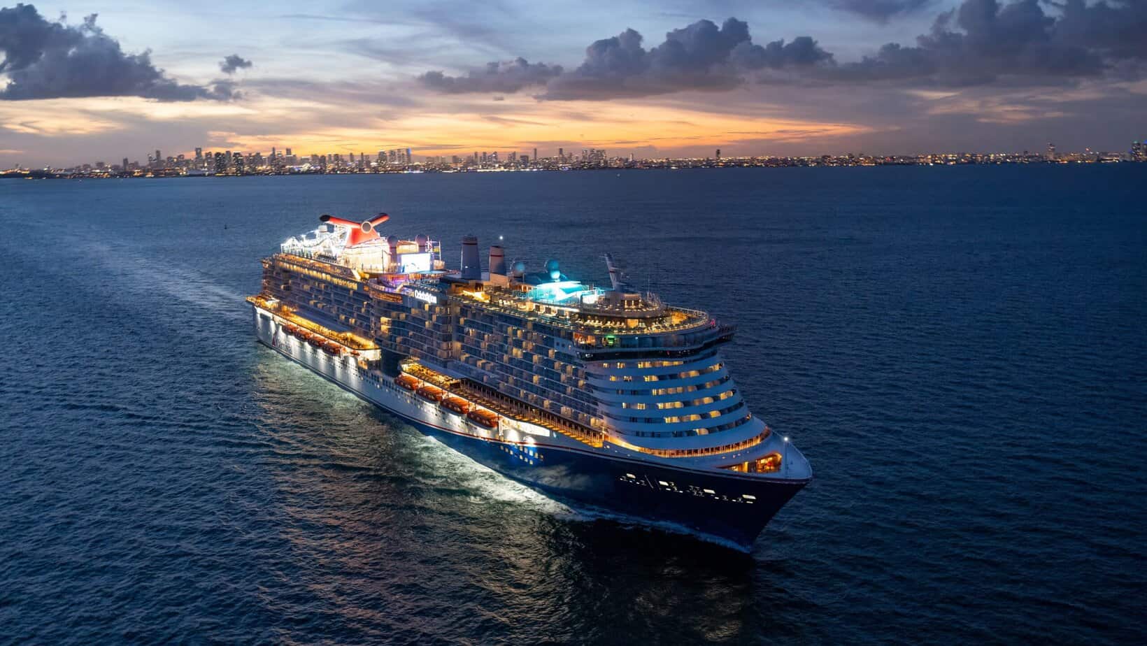 Carnival Celebration sailing at sunset as Carnival introduces the new Carnival Rewards loyalty program.